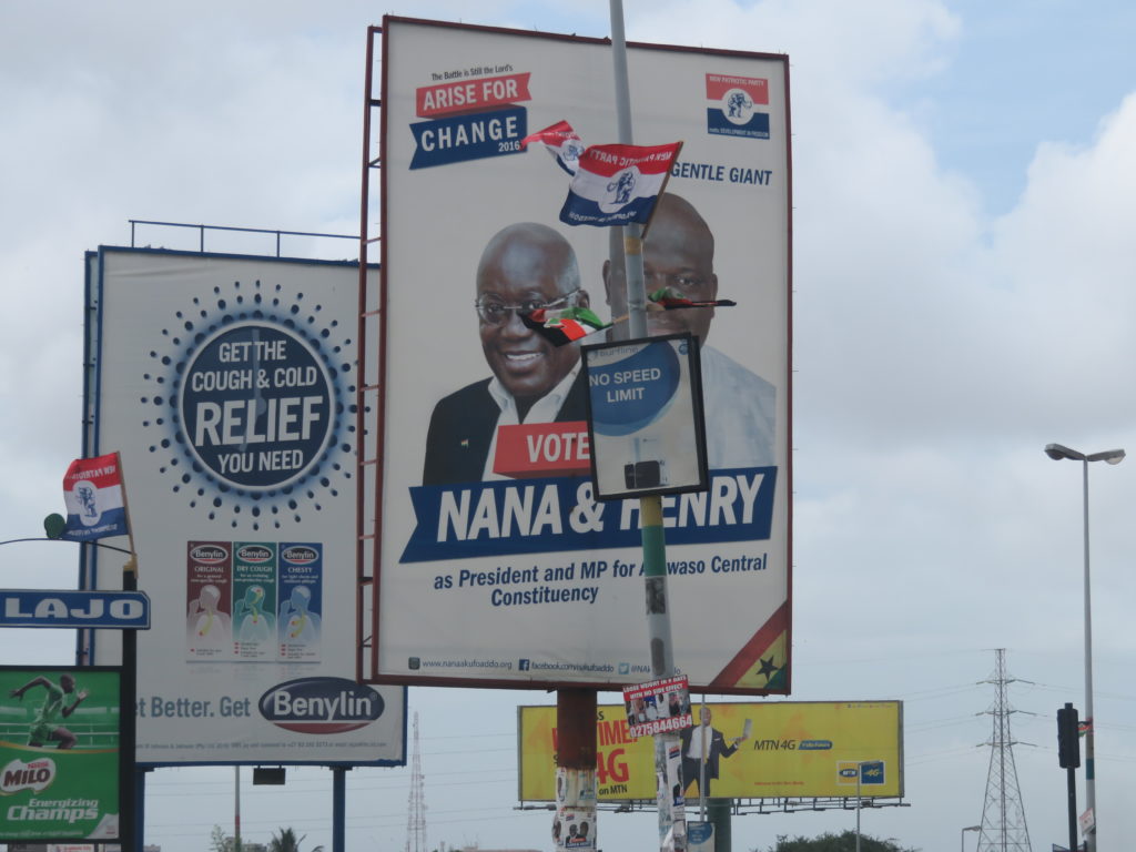 The NPP billboard of the party's flag bearer with the Ayawaso Central parliamentary candidate, Henry Quartey at Alajo junction